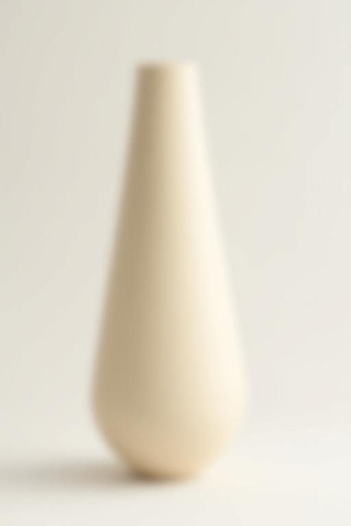 Tall, slender minimalist ceramic vase with a matte finish